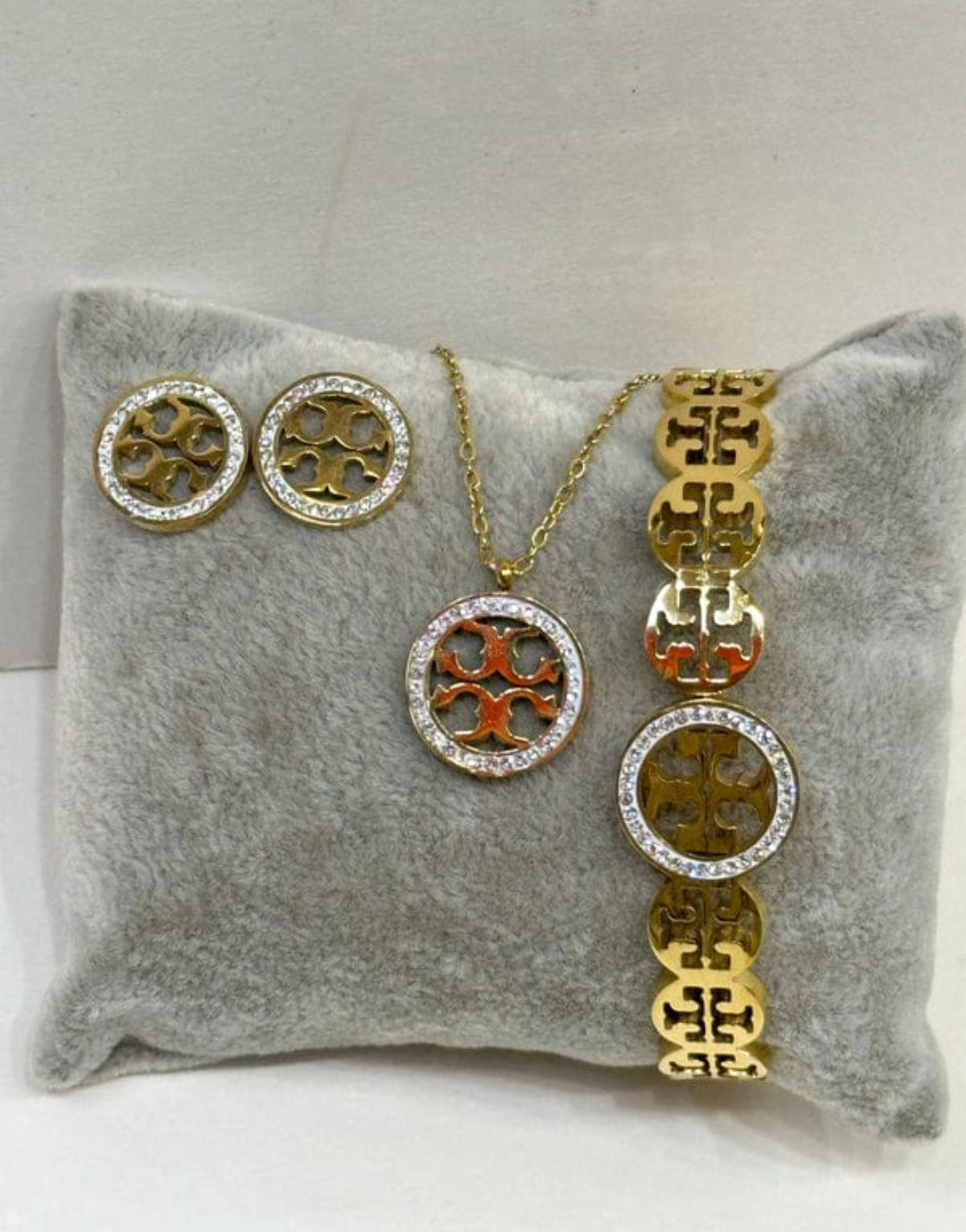 Elegant Gold and Crystal Jewelry Set with Iconic Logo Design