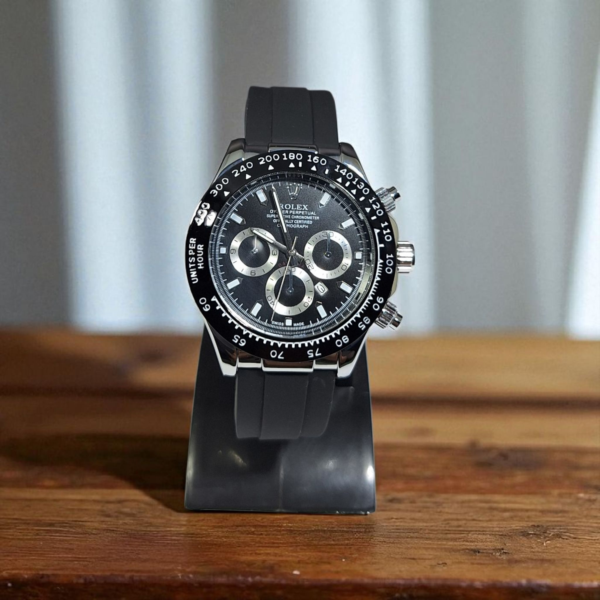Black watch on a stand with a blurred background