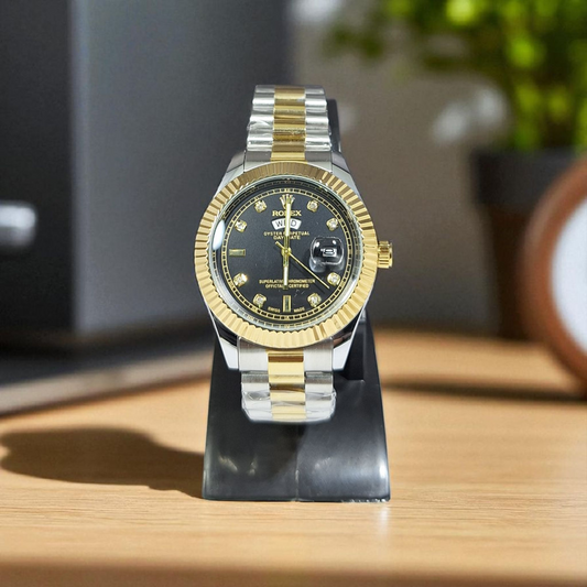 Two-tone watch on a stand with a blurred background